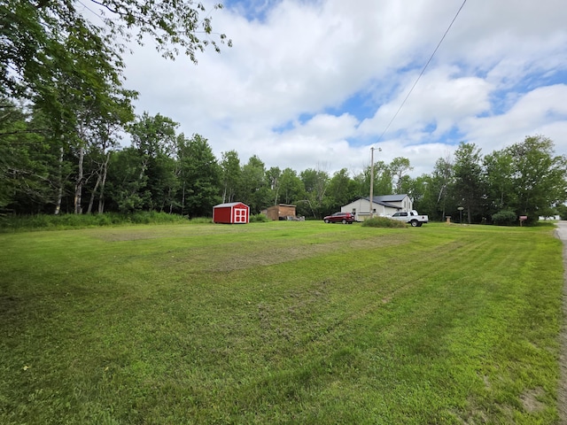 17 Cross St, Kingman Twp, ME 04451 - view of green lawn featuring a storage unit