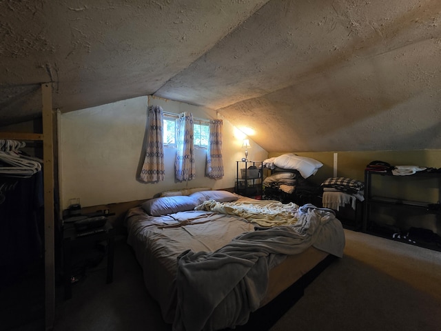 17 Cross St, Kingman Twp, ME 04451 - carpeted bedroom featuring vaulted ceiling and a textured ceiling