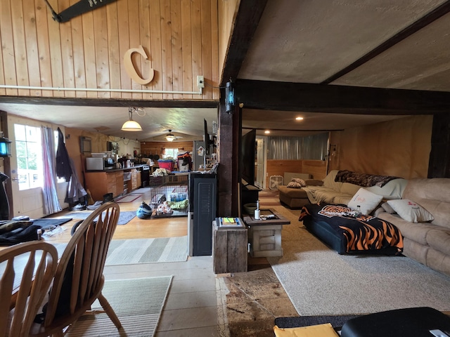 17 Cross St, Kingman Twp, ME 04451 - living room with beamed ceiling and wood walls