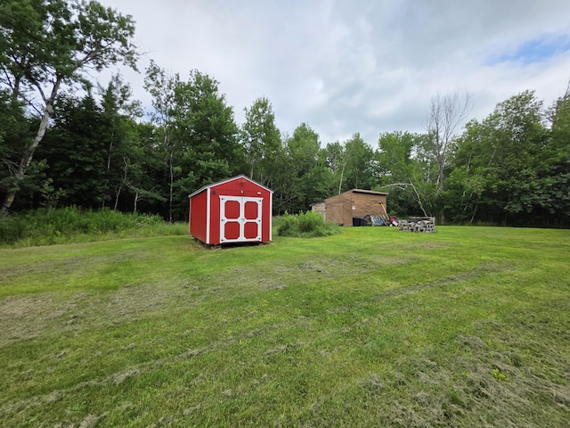 17 Cross St, Kingman Twp, ME 04451 - view of green lawn with a storage unit