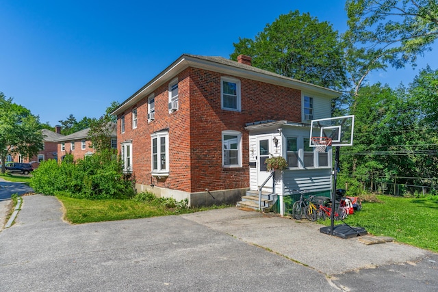 46 Meadow Way, Bath, ME 04530 - view of front of property featuring entry steps, a chimney, and brick siding