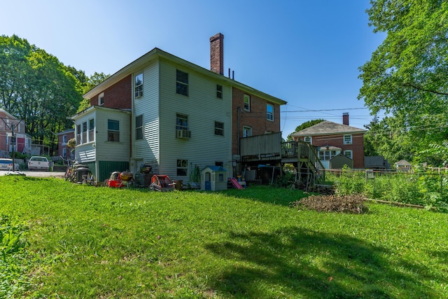 46 Meadow Way, Bath, ME 04530 - back of property with a chimney, cooling unit, and a deck