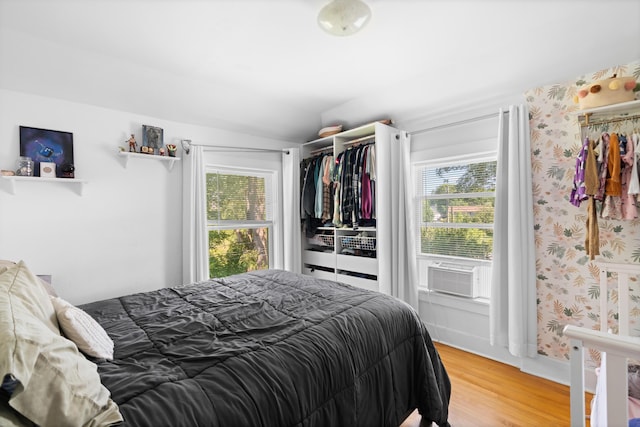 46 Meadow Way, Bath, ME 04530 - bedroom with multiple windows, cooling unit, light wood-style flooring, and lofted ceiling
