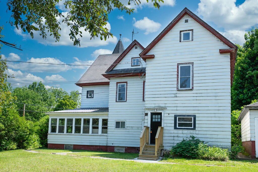 3 Smithville Rd, Rumford, ME 04276 - rear view of house with entry steps and a yard