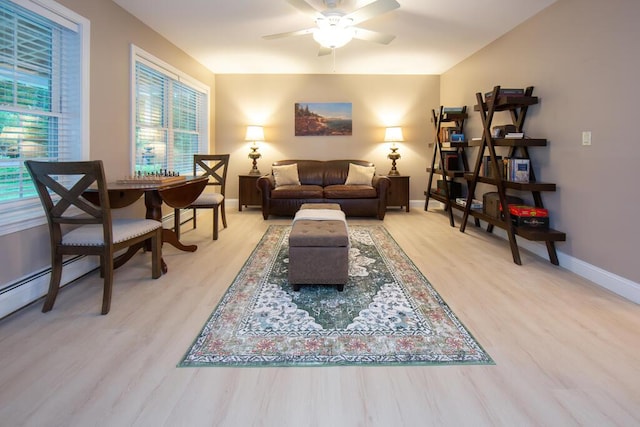 106 Sunset Bay Dr, Steuben, ME 04680 - living area with ceiling fan and wood finished floors
