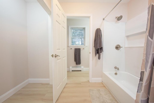 106 Sunset Bay Dr, Steuben, ME 04680 - full bathroom with a baseboard heating unit, wood finished floors, and shower / tub combo