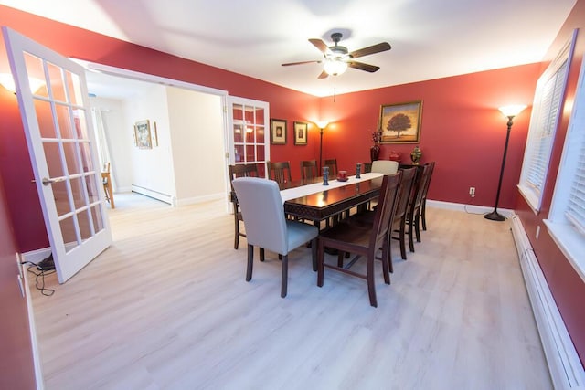 106 Sunset Bay Dr, Steuben, ME 04680 - dining area featuring a baseboard heating unit, ceiling fan, and light wood finished floors
