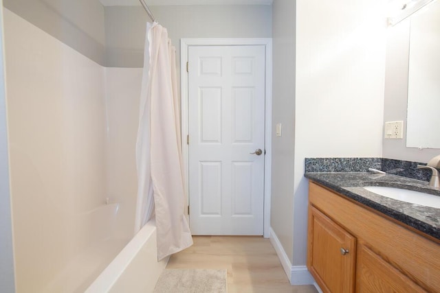 106 Sunset Bay Dr, Steuben, ME 04680 - full bathroom with vanity, wood finished floors, and shower / bathtub combination with curtain