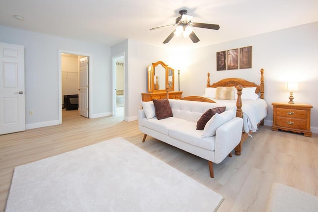 106 Sunset Bay Dr, Steuben, ME 04680 - bedroom featuring light wood-style floors, a walk in closet, and ceiling fan
