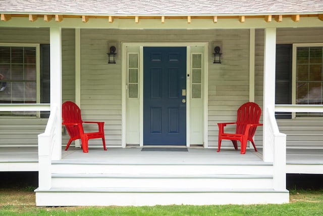 106 Sunset Bay Dr, Steuben, ME 04680 - view of exterior entry featuring a porch and roof with shingles