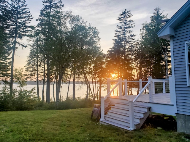106 Sunset Bay Dr, Steuben, ME 04680 - yard at dusk with a deck with water view, a yard, and stairs