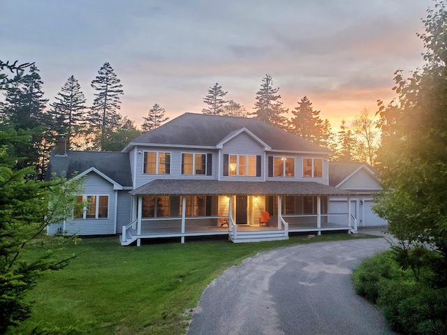 106 Sunset Bay Dr, Steuben, ME 04680 - view of front facade featuring driveway, covered porch, a lawn, and a chimney