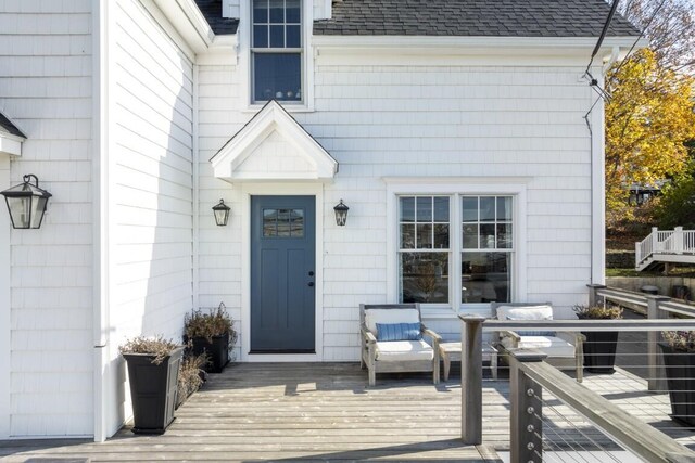 38 Atlantic Ave, Boothbay Harbor, ME 04538 - view of exterior entry with a wooden deck and a shingled roof