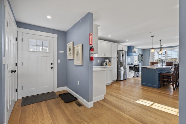 38 Atlantic Ave, Boothbay Harbor, ME 04538 - entryway featuring light wood finished floors and recessed lighting