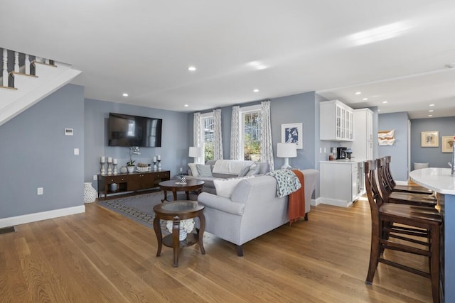 38 Atlantic Ave, Boothbay Harbor, ME 04538 - living room with wood finished floors, recessed lighting, and stairway
