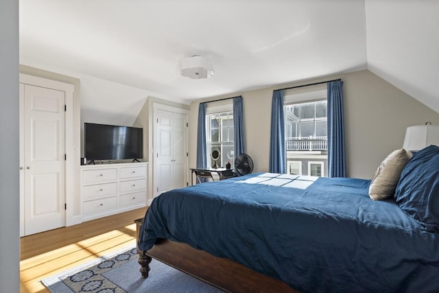 38 Atlantic Ave, Boothbay Harbor, ME 04538 - bedroom featuring wood finished floors and vaulted ceiling