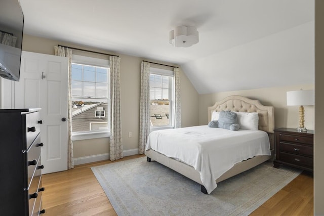 38 Atlantic Ave, Boothbay Harbor, ME 04538 - bedroom with light wood-type flooring and vaulted ceiling