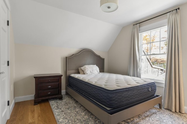 38 Atlantic Ave, Boothbay Harbor, ME 04538 - bedroom with lofted ceiling and wood finished floors