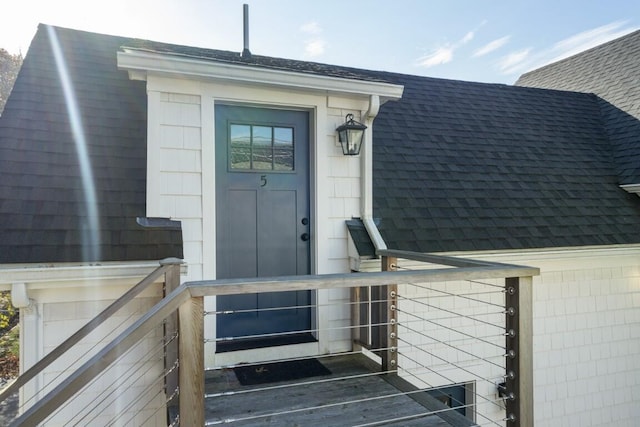38 Atlantic Ave, Boothbay Harbor, ME 04538 - doorway to property with a shingled roof