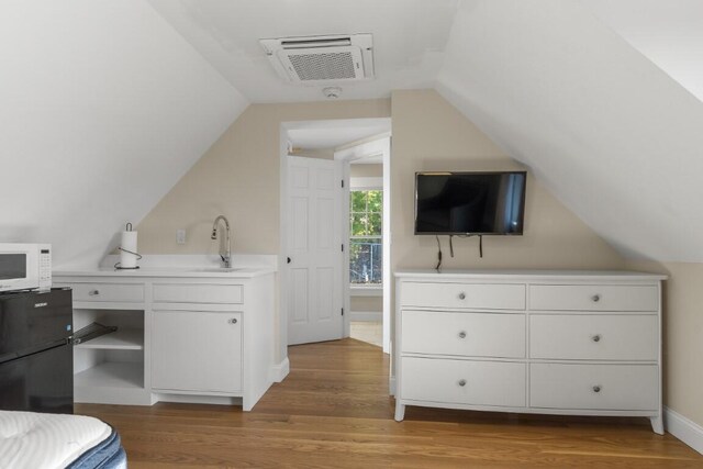 38 Atlantic Ave, Boothbay Harbor, ME 04538 - bedroom featuring lofted ceiling and wood finished floors