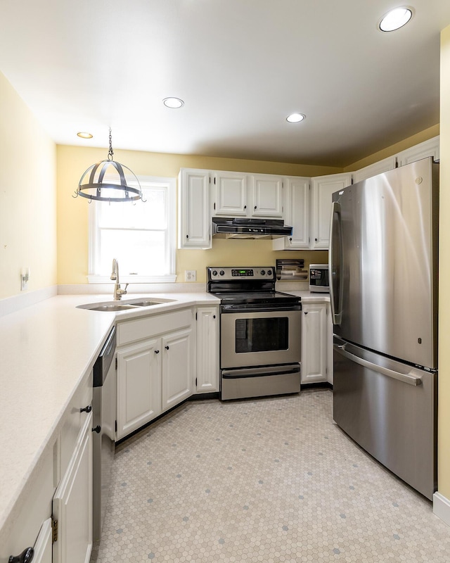 3 Curtis Ave, Camden, ME 04843 - kitchen with stainless steel appliances, extractor fan, light countertops, white cabinets, and recessed lighting