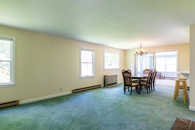 3 Curtis Ave, Camden, ME 04843 - carpeted dining room with baseboard heating and a chandelier