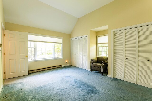 3 Curtis Ave, Camden, ME 04843 - unfurnished bedroom with a baseboard radiator, multiple closets, carpet floors, multiple windows, and vaulted ceiling