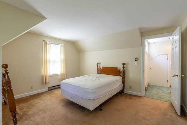 3 Curtis Ave, Camden, ME 04843 - bedroom with light carpet, vaulted ceiling, and a baseboard radiator