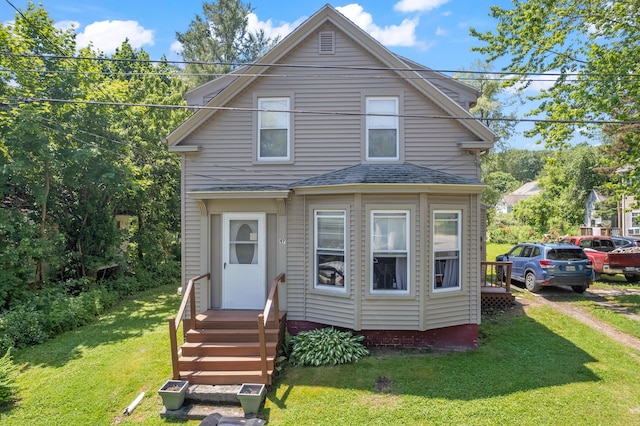 47 Fall Brook St, Portland, ME 04103 - view of front facade with a front yard and entry steps