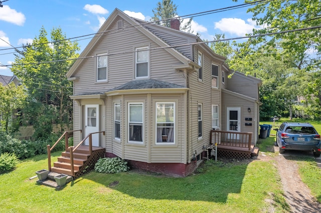 47 Fall Brook St, Portland, ME 04103 - view of front of house featuring a chimney, a front lawn, and roof with shingles