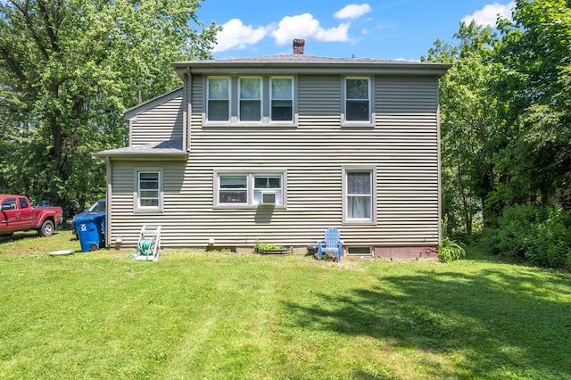 47 Fall Brook St, Portland, ME 04103 - rear view of property featuring a chimney and a lawn
