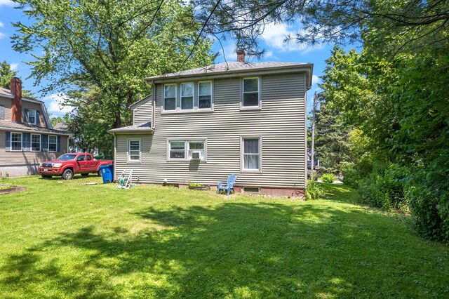 47 Fall Brook St, Portland, ME 04103 - back of property with a chimney and a lawn