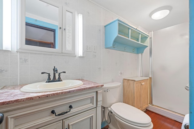 219 Mouse Ln, Alfred, ME 04002 - bathroom with a stall shower, vanity, wood finished floors, and backsplash