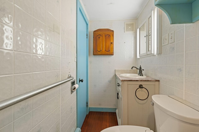 219 Mouse Ln, Alfred, ME 04002 - half bath featuring tile walls, vanity, and wood finished floors