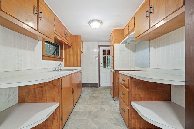 219 Mouse Ln, Alfred, ME 04002 - kitchen featuring under cabinet range hood, light countertops, and brown cabinetry
