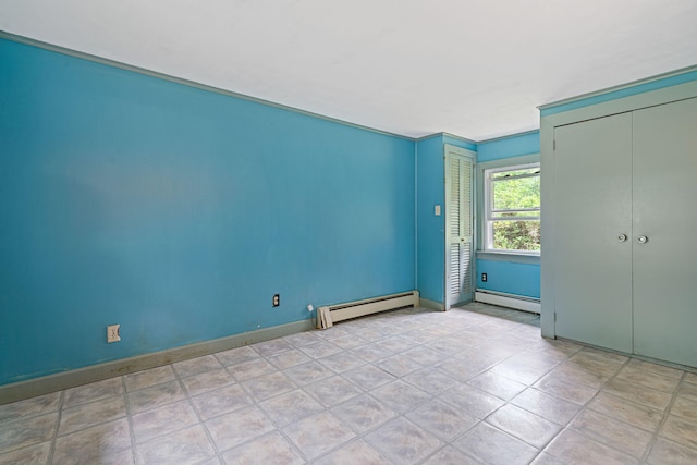 219 Mouse Ln, Alfred, ME 04002 - unfurnished bedroom with a baseboard radiator and two closets