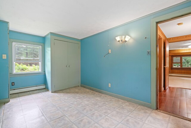 219 Mouse Ln, Alfred, ME 04002 - unfurnished bedroom featuring a baseboard heating unit and a closet