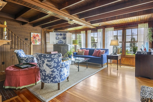 78 Seashore Ave, Portland, ME 04108 - living area featuring a wooden ceiling with exposed beams, wood walls, wood finished floors, and stairs