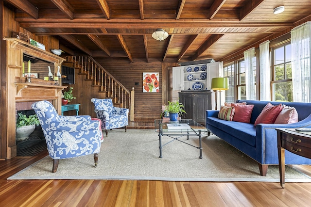 78 Seashore Ave, Portland, ME 04108 - living room with a wooden ceiling with exposed beams, stairway, wood finished floors, wooden walls, and a fireplace