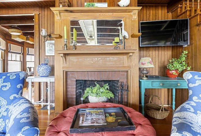 78 Seashore Ave, Portland, ME 04108 - living area with wooden walls, wood finished floors, a brick fireplace, and wooden ceiling