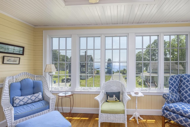 78 Seashore Ave, Portland, ME 04108 - sunroom / solarium featuring healthy amount of natural light, wood walls, ornamental molding, wood finished floors, and wooden ceiling