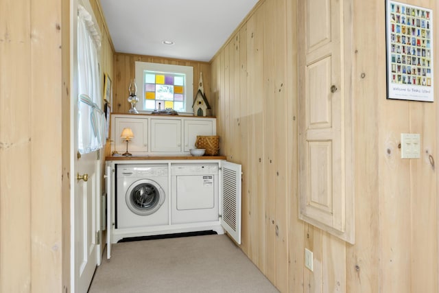 78 Seashore Ave, Portland, ME 04108 - washroom featuring washing machine and clothes dryer, cabinet space, carpet, and wooden walls
