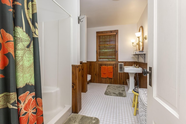 78 Seashore Ave, Portland, ME 04108 - full bath with wainscoting, a shower with shower curtain, tile patterned flooring, and wood walls