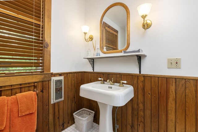 78 Seashore Ave, Portland, ME 04108 - bathroom with wainscoting, wood walls, heating unit, and tile patterned flooring