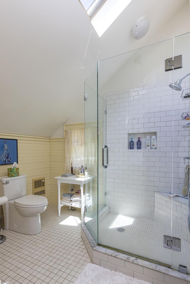78 Seashore Ave, Portland, ME 04108 - bathroom with vaulted ceiling, a shower stall, and tile patterned flooring