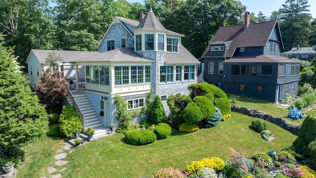 78 Seashore Ave, Portland, ME 04108 - back of house with stairway, a lawn, a chimney, and view of wooded area