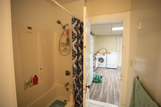99 Sanford St, Bangor, ME 04401 - bathroom with washing machine and dryer, wood finished floors, and shower / bath combination with curtain
