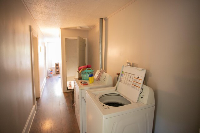 99 Sanford St, Bangor, ME 04401 - laundry area featuring washing machine and dryer, ornamental molding, dark wood-style floors, and a textured ceiling