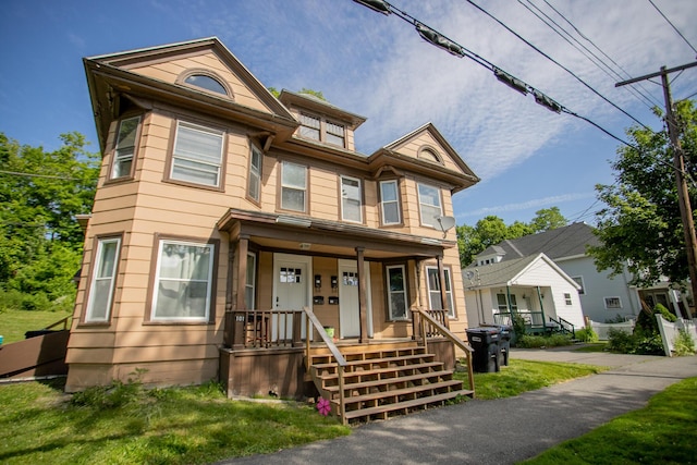 99 Sanford St, Bangor, ME 04401 - townhome / multi-family property featuring a porch and a front yard