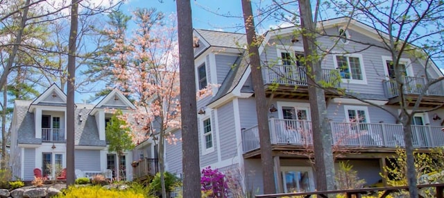 306 Eddy Rd Unit 310, Edgecomb, ME 04556 - view of side of home featuring a balcony, roof with shingles, and a gambrel roof
